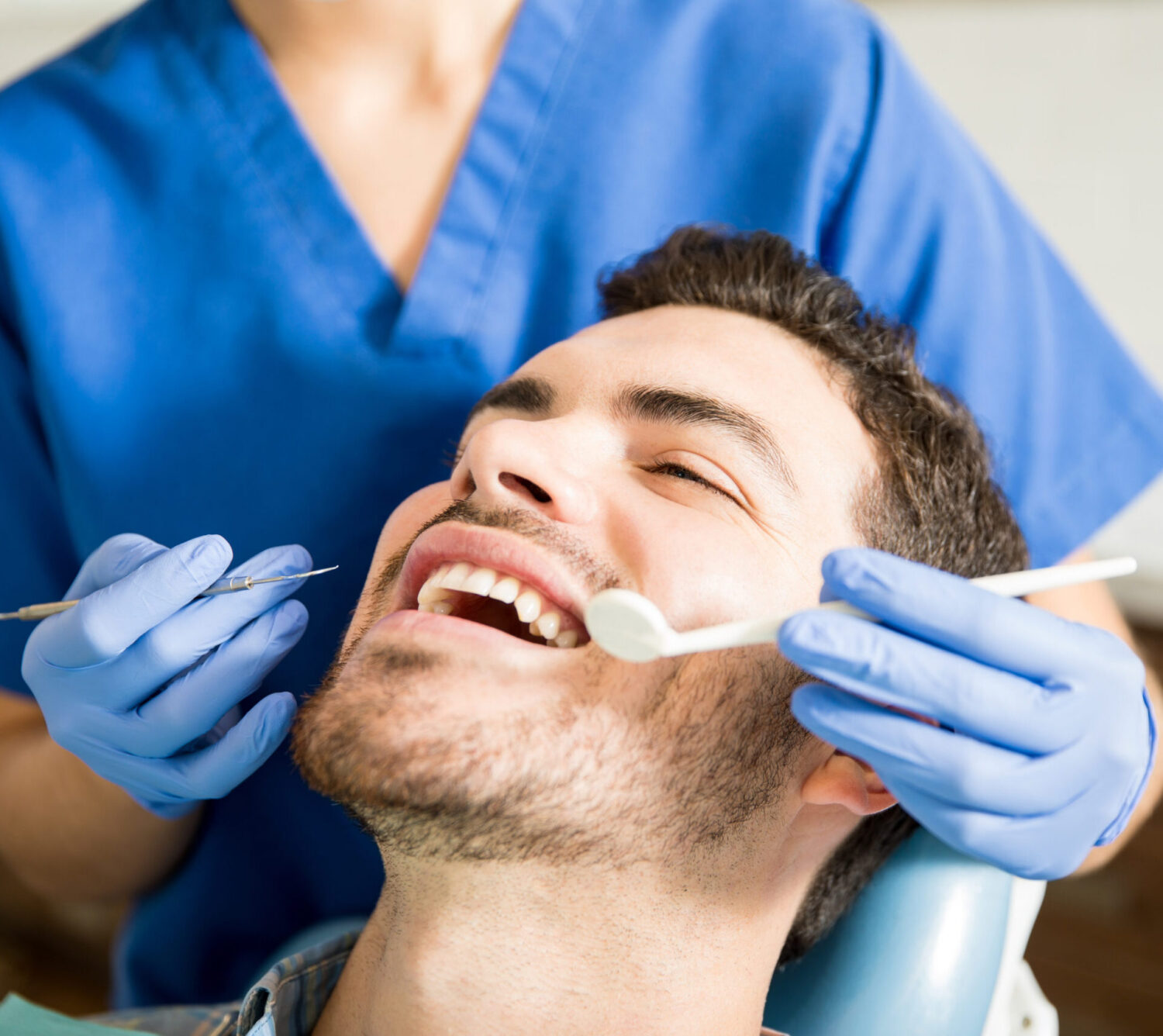 male adult patient with dental assistant