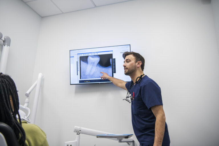Dr. Uram patient and helpful reviewing xrays regarding an emergency procedure